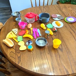 - Kitchen accessories toys for a toy kitchen.   Food ,pots, and dishes.